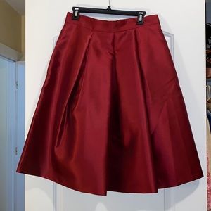 Deep red polyester peplum mid-length skirt size 10